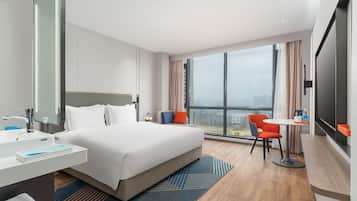 Premium bedding, down comforters, minibar, laptop workspace