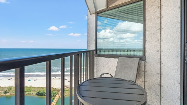 A balcony with a view of the beach and ocean. - Unique Beachside Studio at Myrtle Beach Resort (Myrtle Beach)