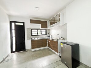 Fridge, cookware/dishes/utensils, dining tables