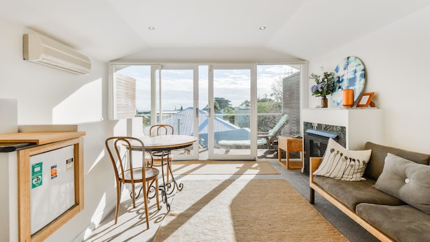Deluxe Studio Suite | Living area | 75-inch LCD TV with digital channels - By the Seaside  (Mornington)