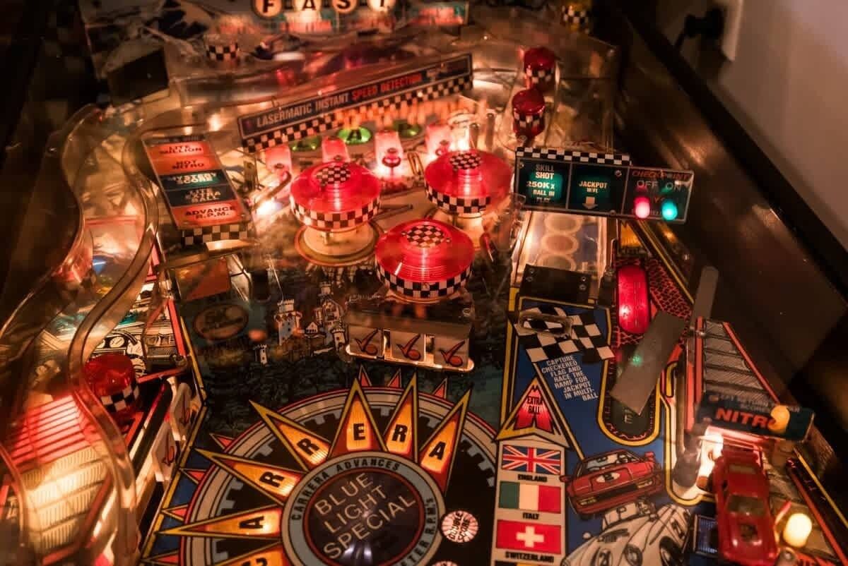 A pinball machine with various game elements and text, including "Laseromatic Instant Speed Detection" and "Blue Light Special."