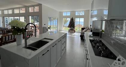 Beachfront. Direct access to safe sandy beach.