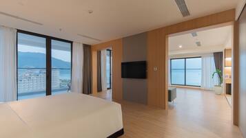 Executive Suite, Ocean View | Living area | 42-inch Smart TV with digital channels, ping pong