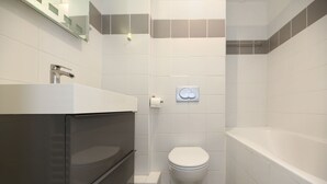 Shower, hair dryer, towels, shampoo