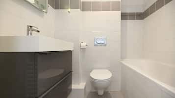 Shower, hair dryer, towels, shampoo