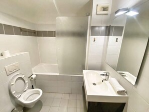 Shower, hair dryer, towels, shampoo