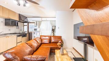 Deluxe House | Living area | Flat-screen TV