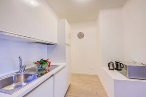 Familieleilighet, flere soverom (Casa Bougainville Shared Pool &) | Eget kjøkken | Kokeplater, kaffetrakter/tekoker, vannkoker og brødrister