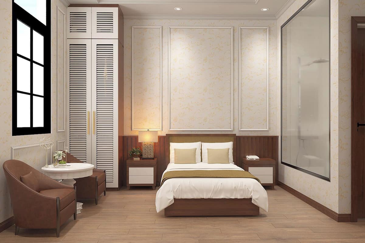 A bedroom with a bed, a desk, a chair, a nightstand, and a window.