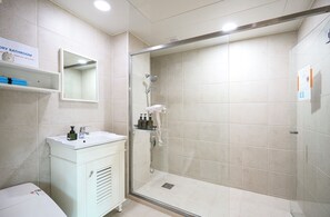 Premier House (non-Korean nationals only) | Bathroom | Shower, hair dryer, slippers, towels - Hongdae Private Guesthouse (Seoul)