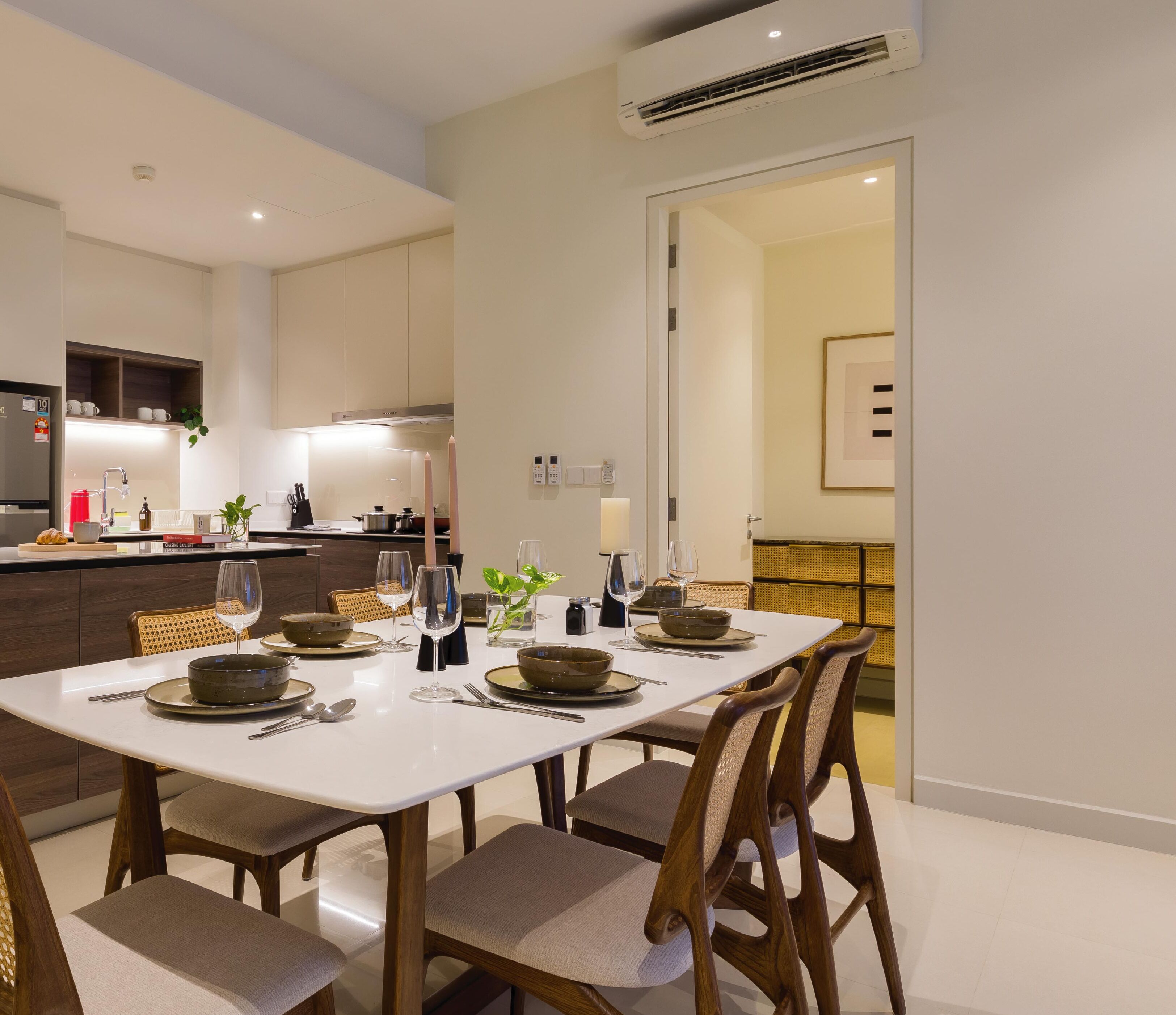A modern kitchen with a dining area.