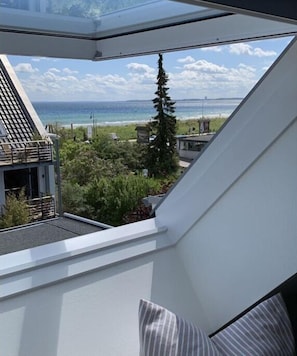 Enjoy a peaceful retreat with a balcony offering ocean views and a lush, well-maintained setting.