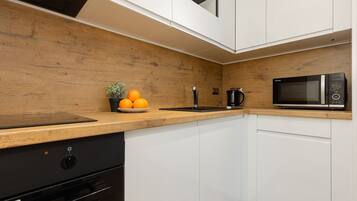 Microwave, dishwasher, highchair, cookware/dishes/utensils