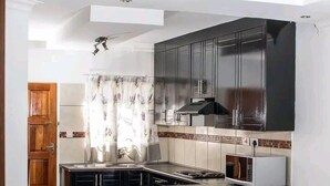 Habitación de lujo, 1 habitación | Cocina privada