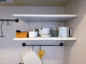 A kitchen shelf with white storage containers, a wooden box, and a pair of yellow scissors. - 2nd Kouzu Glory Heights (Osaka)