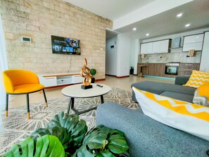 Deluxe Apartment | Living area | 24-inch Smart TV with digital channels - Lux Suites Imagine Luxury Apartments (Nairobi)