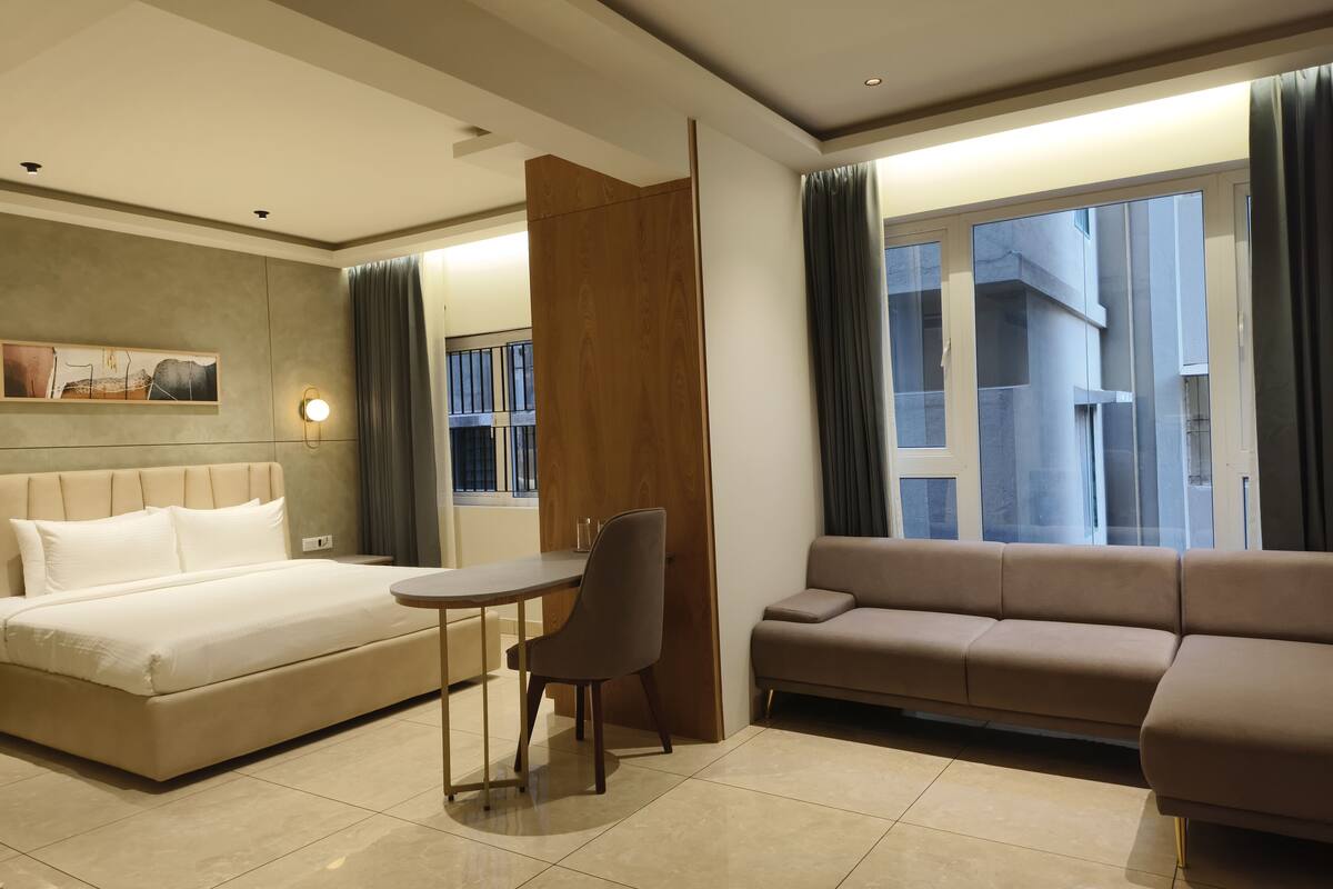 Executive Double Room | Living area | Flat-screen TV