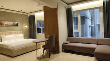 Executive Double Room | Living area | Flat-screen TV