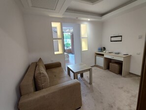 Quarto triplo conforto | Área de estar