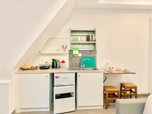 Apartamento | Cozinha privada | Torradeira, toalhas de papel