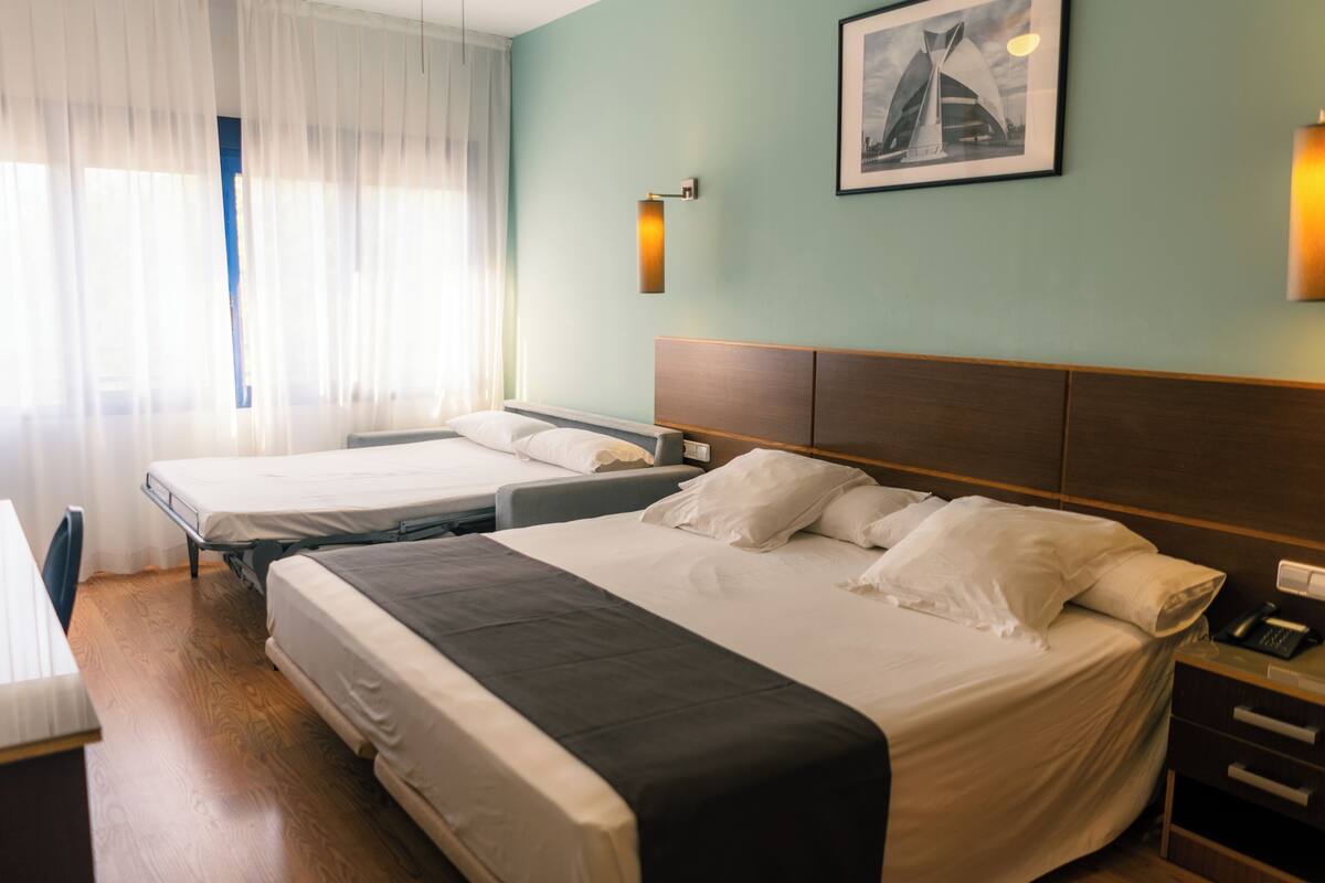 Quadruple Room | Premium bedding, down comforters, soundproofing