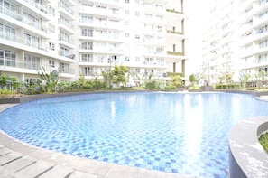 A residential building with a swimming pool.
