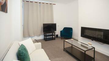 House | Living area | TV, fireplace