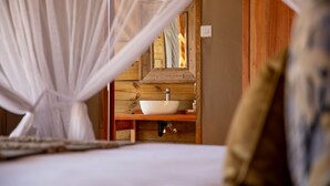 In-room safe, desk, laptop workspace, bed sheets - Mankwe Tented Retreat (Maun)