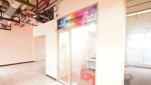 A commercial space with a signboard advertising 'Jual Beli - Sewa' and 'Barbie'. - Hotel O Triple N Homestay (Sidoarjo)