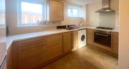 Spacious room with study table next to university