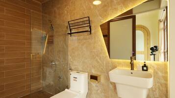Shower, hair dryer, towels, shampoo