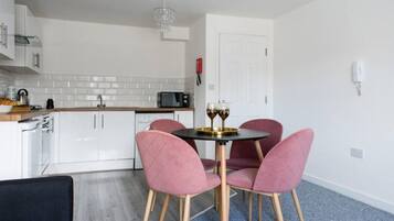 Comfort Apartment | Private kitchen | Full-size fridge, microwave, oven, stovetop