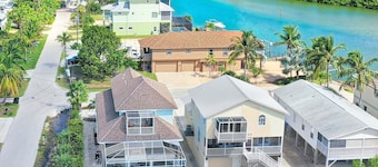 Steps from Bonita Beach! Great family home with a pool on salt water canal!