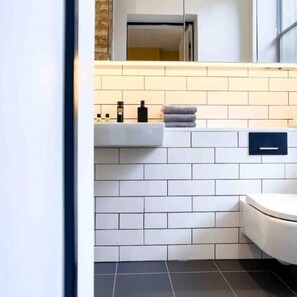 Shower, hair dryer, towels, soap