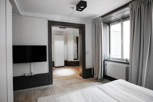 Family Apartment Small | Premium bedding, blackout drapes, iron/ironing board, free WiFi