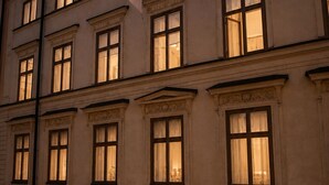 A building with multiple windows, a flag, and a number '5' sign. - Guldgränd  (Stockholm)