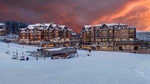 A large lodge with multiple floors and a ski lift in the foreground. - PEAK 8 SKI IN / SKI OUT 2BD/2BA at GRAND COLORADO. SLEEPS UP TO 8. (Breckenridge)