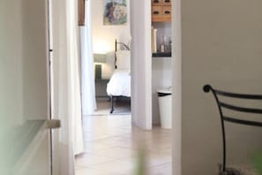 Enter a serene space with a comfortable bed and a convenient nightstand.