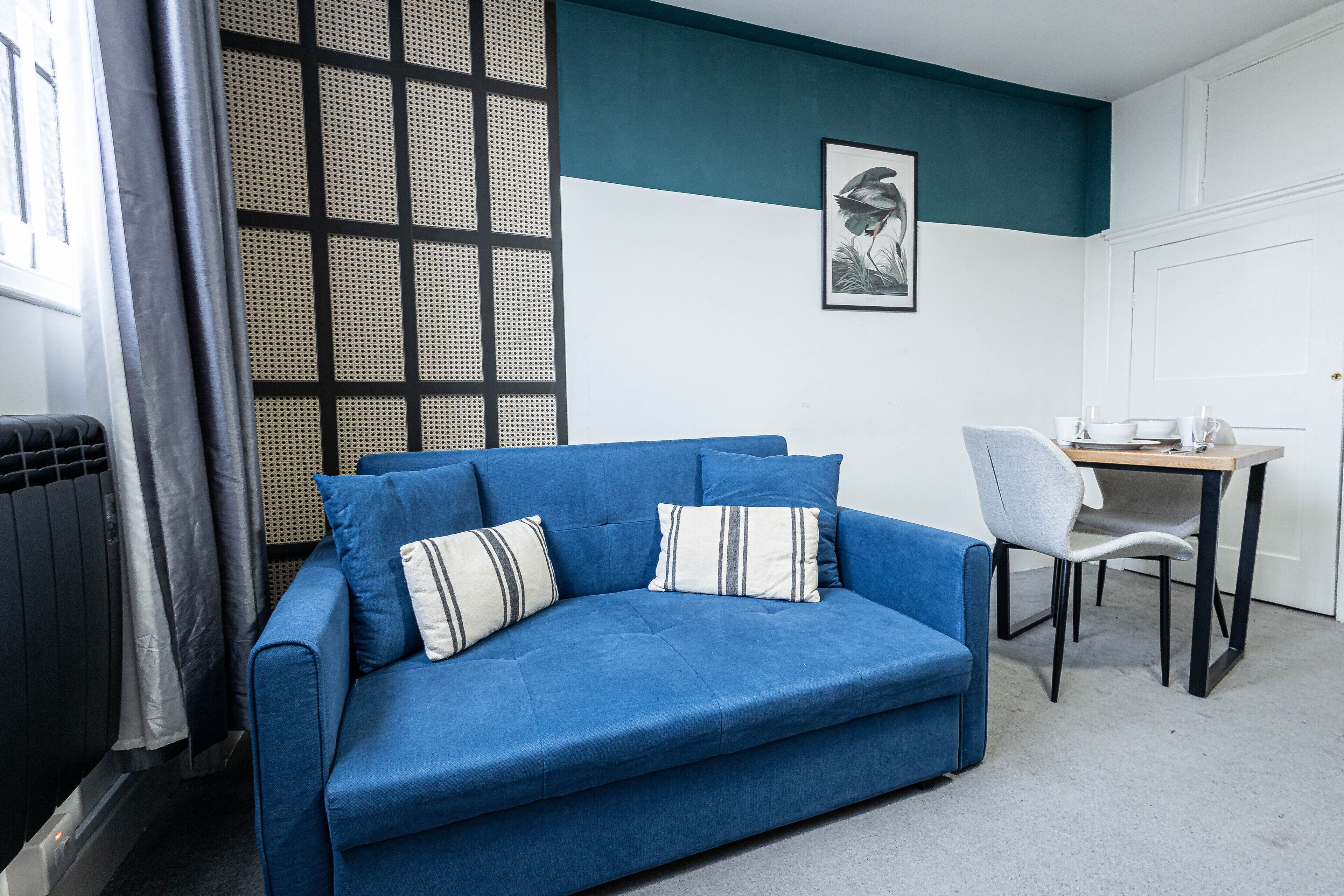 Premier Apartment, 1 Double Bed with Sofa bed, City View | Living area | 32-inch Smart TV with cable channels