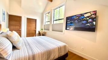 1 bedroom, desk, iron/ironing board, travel crib