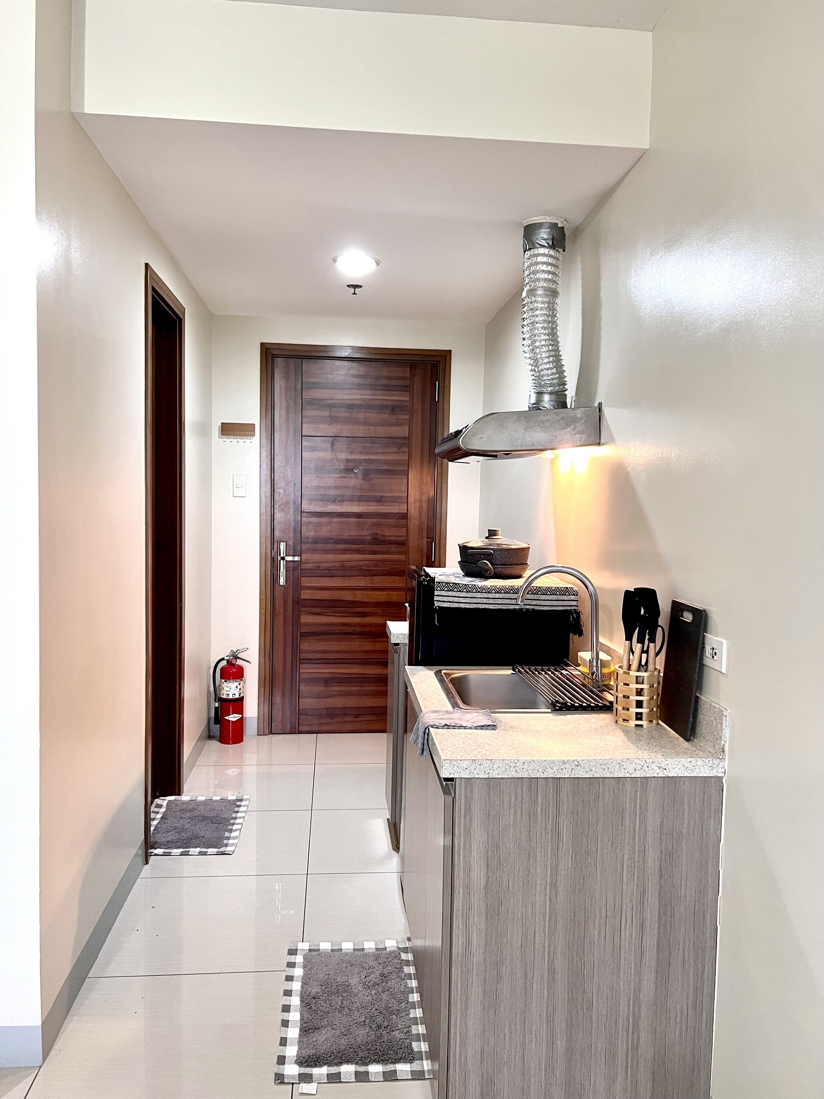 Fridge, electric kettle, cookware/dishes/utensils