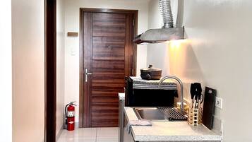 Fridge, electric kettle, cookware/dishes/utensils