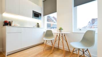 Standard Studio Apartment | Living area | Flat-screen TV