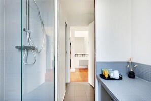 Shower, hair dryer, towels, soap