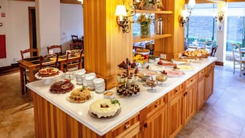 A buffet with various desserts and snacks.