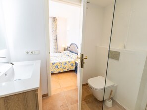 Shower, hair dryer, towels, toilet paper