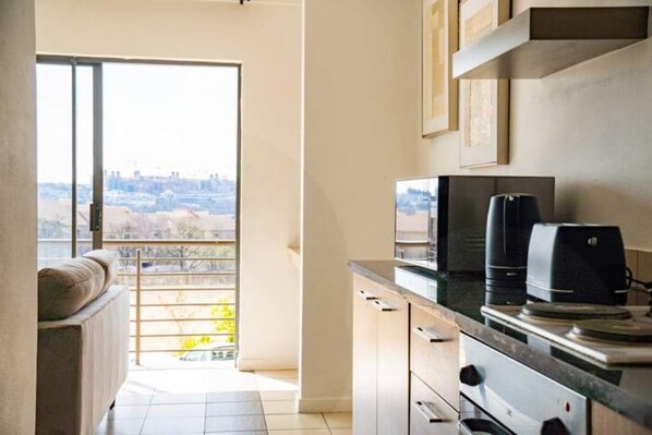 Enjoy a city view from this kitchen with an oven and microwave.