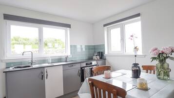 Fridge, electric kettle, toaster, cookware/dishes/utensils