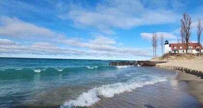 Experience panoramic views in ur 5-bed Frankfort retreat minute to Lake Michigan