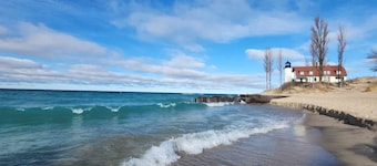 Experience panoramic views in ur 5-bed Frankfort retreat minute to Lake Michigan
